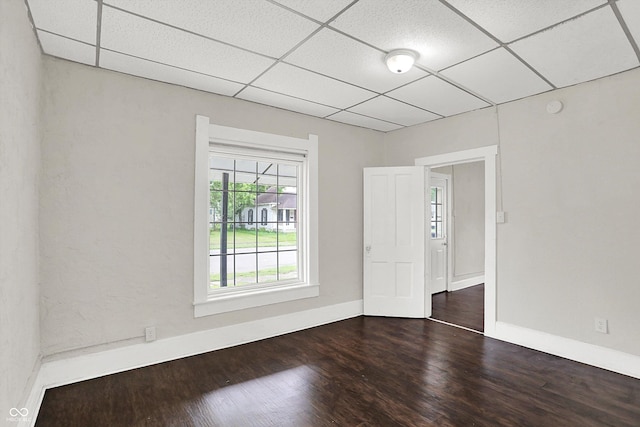 1418 W 5th St, Anderson, IN 46016 - unfurnished room featuring a drop ceiling, wood finished floors, and a smoke detector