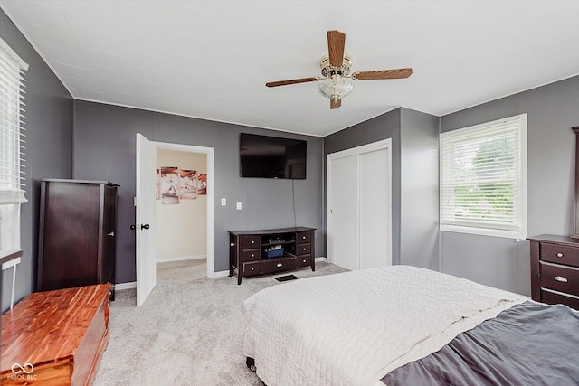 216 N Clinton St, Boswell, IN 47921 - bedroom with light colored carpet, a closet, and a ceiling fan