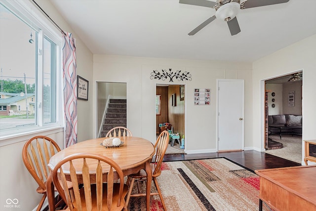 216 N Clinton St, Boswell, IN 47921 - dining space featuring a ceiling fan, stairway, plenty of natural light, and wood finished floors