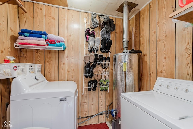 216 N Clinton St, Boswell, IN 47921 - laundry area featuring wooden walls, washing machine and clothes dryer, and water heater