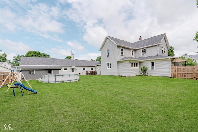 216 N Clinton St, Boswell, IN 47921 - rear view of property featuring a playground, an outdoor pool, and a chimney
