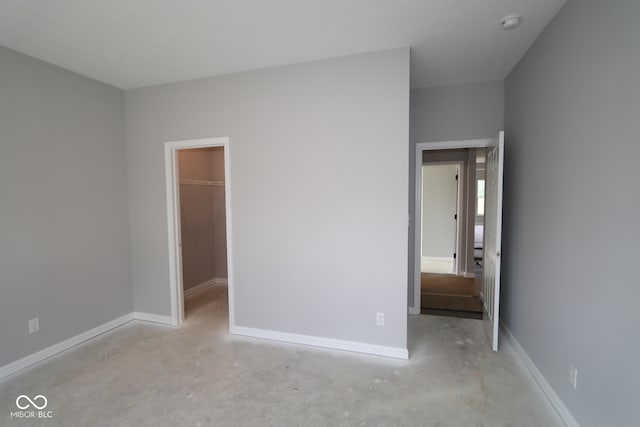 10424 Oak Bend Blvd, Indianapolis, IN 46239 - unfurnished bedroom with a spacious closet, unfinished concrete floors, and a closet