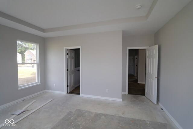 10424 Oak Bend Blvd, Indianapolis, IN 46239 - unfurnished bedroom featuring a raised ceiling and baseboards