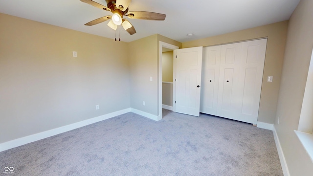 1809 S H St, Elwood, IN 46036 - unfurnished bedroom with carpet floors, a closet, and a ceiling fan