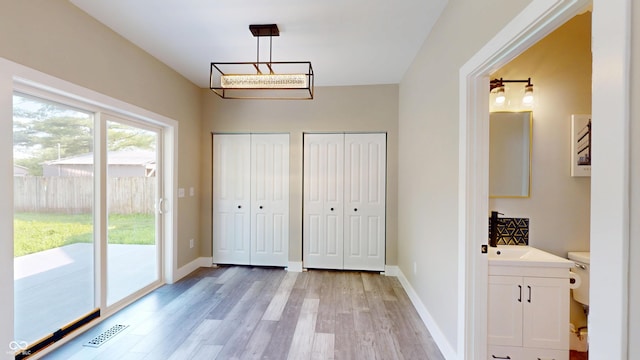 1809 S H St, Elwood, IN 46036 - unfurnished dining area with light wood-style floors