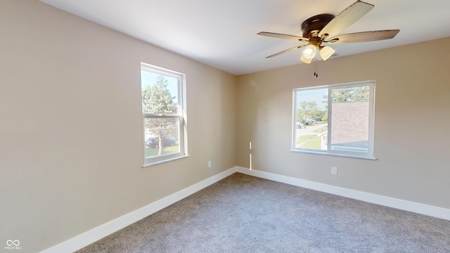 1809 S H St, Elwood, IN 46036 - unfurnished room with plenty of natural light, carpet, and a ceiling fan