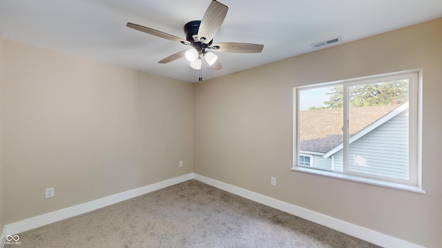 1809 S H St, Elwood, IN 46036 - carpeted empty room with ceiling fan and baseboards