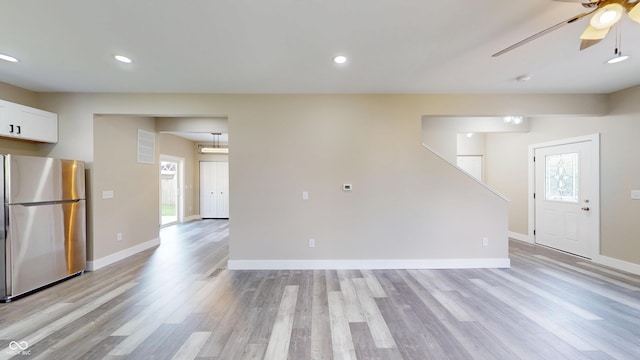1809 S H St, Elwood, IN 46036 - unfurnished living room featuring a ceiling fan, light wood-type flooring, and recessed lighting