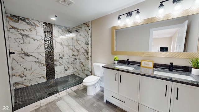1809 S H St, Elwood, IN 46036 - full bath with double vanity, wood finished floors, and a tile shower