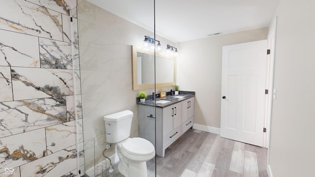1809 S H St, Elwood, IN 46036 - full bathroom with vanity, wood finished floors, and a shower