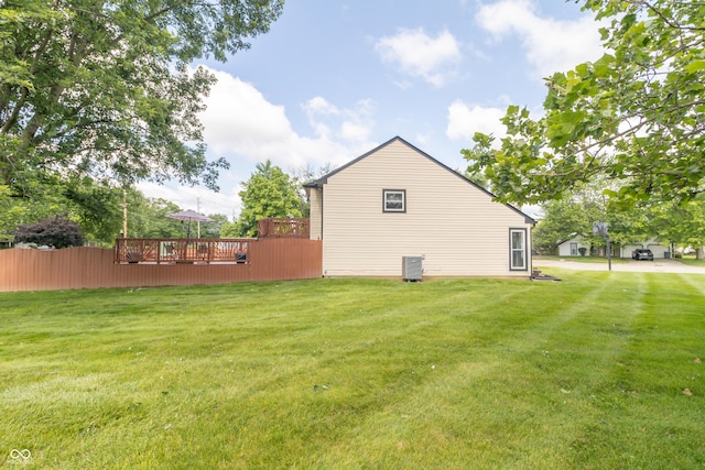 8925 Sunburst Cir, Indianapolis, IN 46227 - view of home's exterior with a wooden deck and a yard