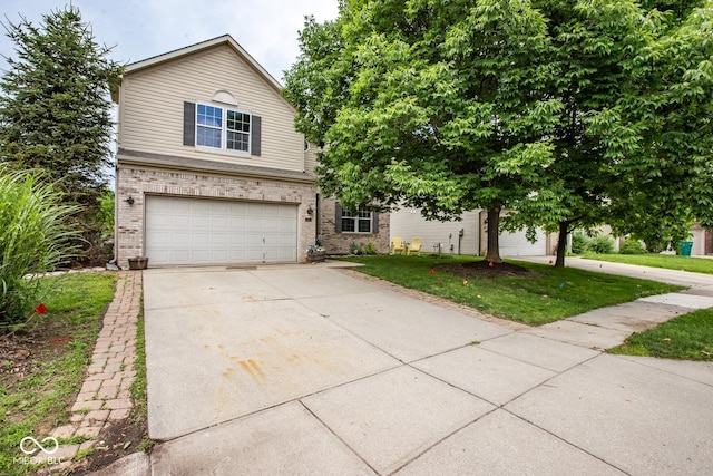 6532 Amherst Way, Zionsville, IN 46077 - view of front facade with brick siding, driveway, an attached garage, and a front lawn