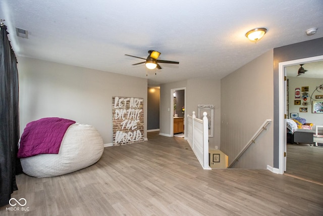 6532 Amherst Way, Zionsville, IN 46077 - sitting room featuring an upstairs landing, wood finished floors, and ceiling fan
