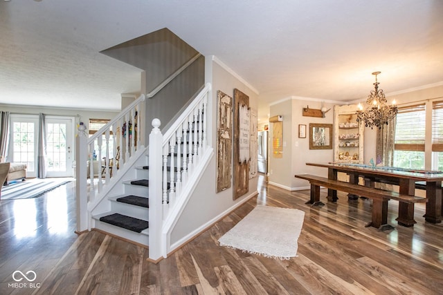 6532 Amherst Way, Zionsville, IN 46077 - foyer with plenty of natural light, wood finished floors, stairs, and ornamental molding