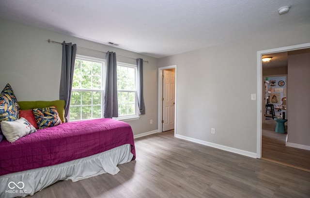 6532 Amherst Way, Zionsville, IN 46077 - bedroom featuring wood finished floors and baseboards