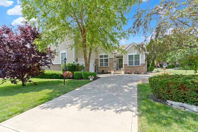 15098 Newburyport Dr, Fortville, IN 46040 - obstructed view of property with a front lawn, brick siding, and concrete driveway