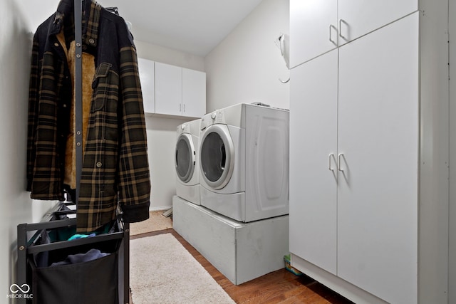 15098 Newburyport Dr, Fortville, IN 46040 - laundry area with washer and dryer, cabinet space, and wood finished floors