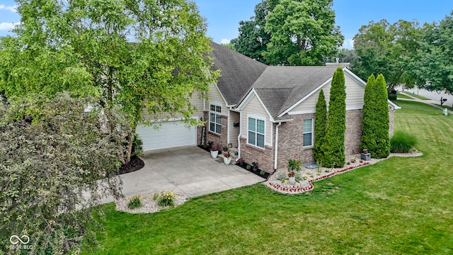 15098 Newburyport Dr, Fortville, IN 46040 - view of front facade featuring concrete driveway, brick siding, a front yard, a shingled roof, and a garage