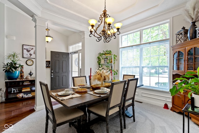 15098 Newburyport Dr, Fortville, IN 46040 - carpeted dining area with healthy amount of natural light, a raised ceiling, a chandelier, crown molding, and decorative columns