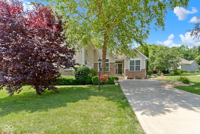15098 Newburyport Dr, Fortville, IN 46040 - obstructed view of property featuring brick siding and a front lawn