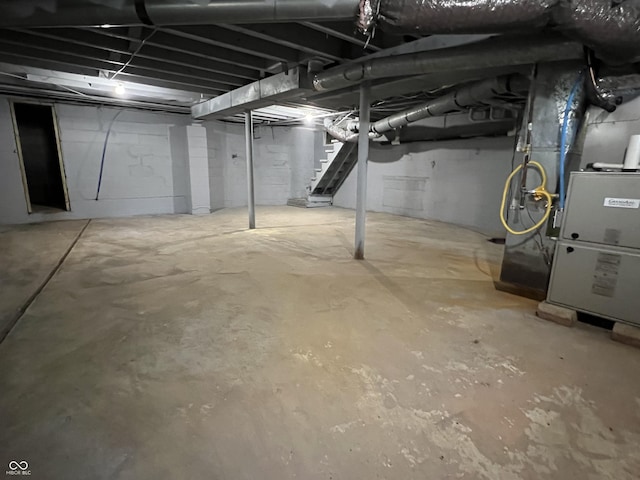 937 N Routiers Ave, Indianapolis, IN 46219 - unfinished below grade area featuring stairs and heating unit