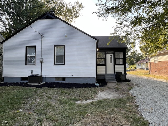 937 N Routiers Ave, Indianapolis, IN 46219 - back of house featuring a shingled roof and entry steps
