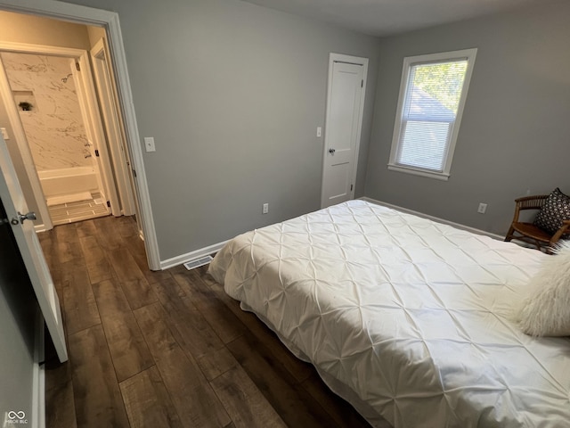 937 N Routiers Ave, Indianapolis, IN 46219 - bedroom featuring dark wood-type flooring and baseboards