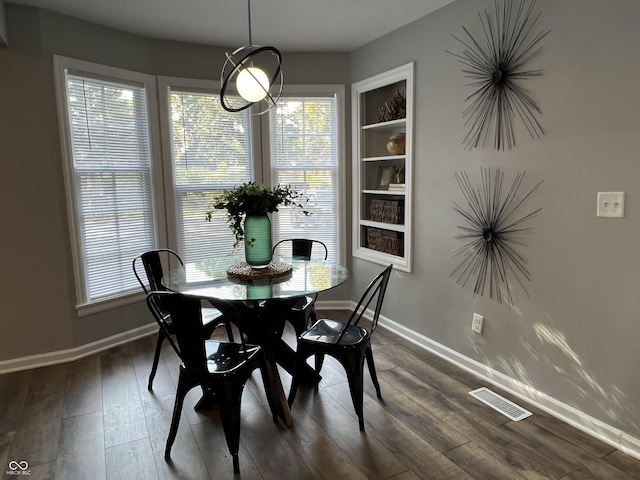 937 N Routiers Ave, Indianapolis, IN 46219 - dining room with plenty of natural light and dark wood-type flooring