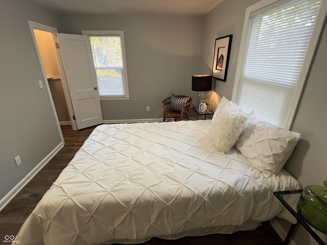 937 N Routiers Ave, Indianapolis, IN 46219 - bedroom featuring dark wood-type flooring and baseboards