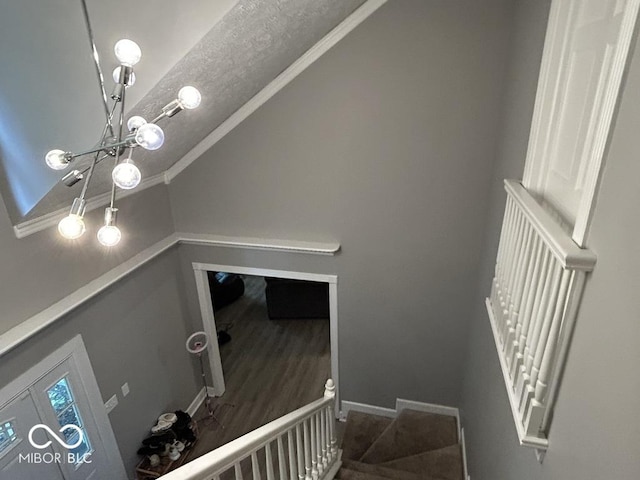 8407 Campbell Ct, Mooresville, IN 46158 - stairs featuring a chandelier, lofted ceiling, crown molding, and a textured ceiling