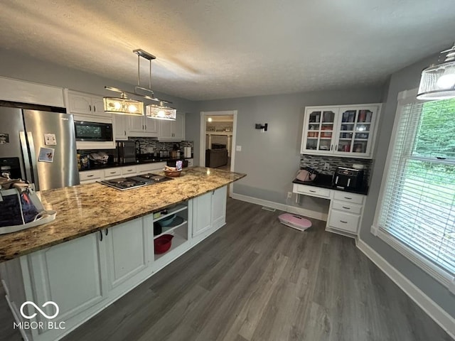 8407 Campbell Ct, Mooresville, IN 46158 - kitchen featuring appliances with stainless steel finishes, white cabinets, backsplash, and a textured ceiling