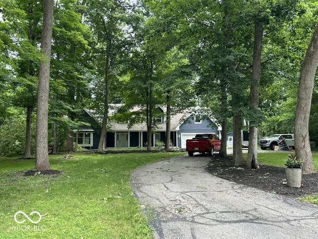 8407 Campbell Ct, Mooresville, IN 46158 - obstructed view of property with an attached garage, a front yard, and driveway