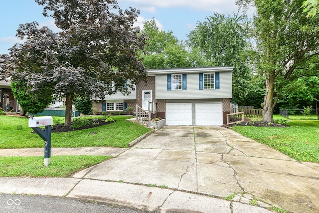 317 Heritage Ct, Fishers, IN 46038 - bi-level home with brick siding, a garage, and driveway