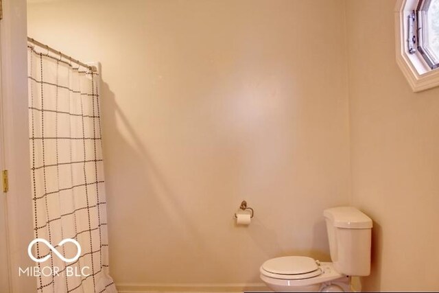 8905 Maze Rd, Indianapolis, IN 46259 - full bathroom featuring toilet and a shower with shower curtain
