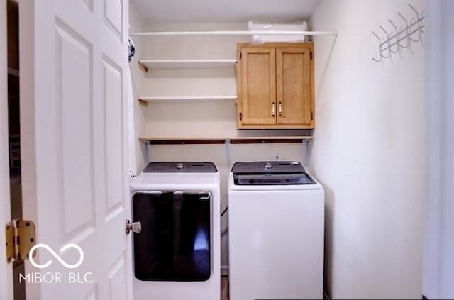 8905 Maze Rd, Indianapolis, IN 46259 - laundry area with washing machine and dryer and cabinet space