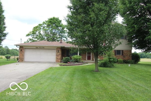 8905 Maze Rd, Indianapolis, IN 46259 - view of front of property with a garage, driveway, and brick siding