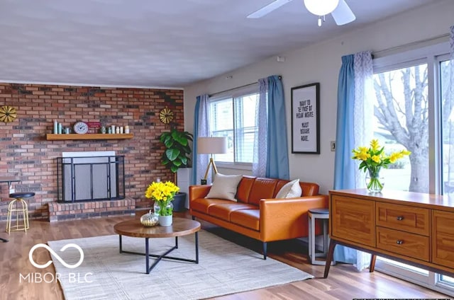 8905 Maze Rd, Indianapolis, IN 46259 - living room featuring wood finished floors, ceiling fan, and a fireplace