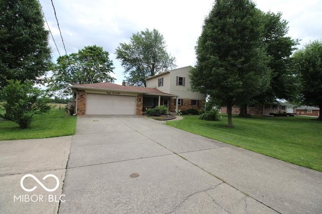 8905 Maze Rd, Indianapolis, IN 46259 - traditional-style house featuring an attached garage, concrete driveway, a front lawn, brick siding, and a chimney