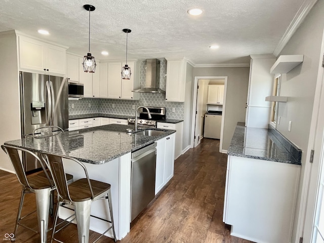 540 Lazy Ln, Greenwood, IN 46142 - kitchen featuring wall chimney exhaust hood, stainless steel appliances, crown molding, decorative backsplash, and white cabinetry