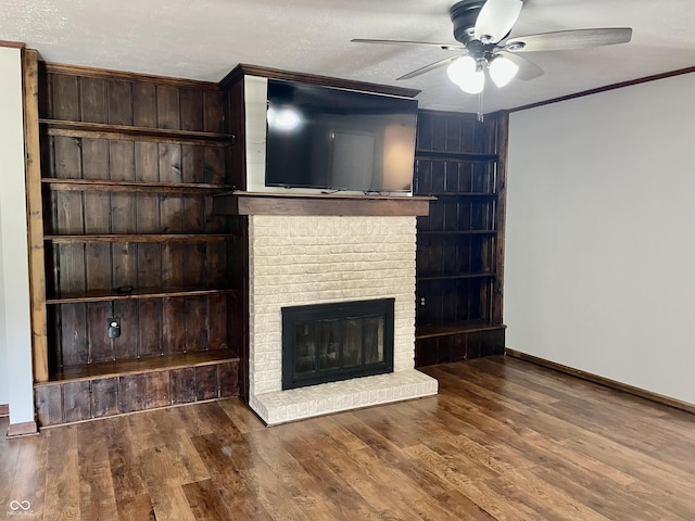 540 Lazy Ln, Greenwood, IN 46142 - unfurnished living room with ceiling fan, a fireplace, wood finished floors, and ornamental molding
