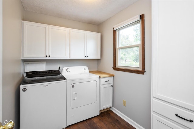 540 Lazy Ln, Greenwood, IN 46142 - laundry area with cabinet space, washing machine and clothes dryer, dark wood finished floors, and a textured ceiling