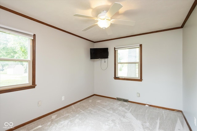 540 Lazy Ln, Greenwood, IN 46142 - spare room featuring healthy amount of natural light, light colored carpet, crown molding, and ceiling fan