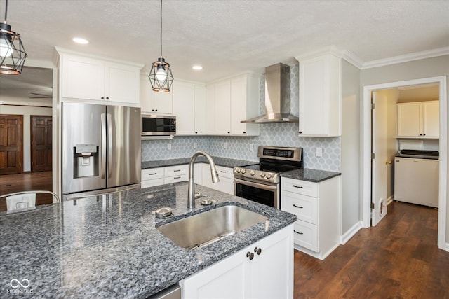 540 Lazy Ln, Greenwood, IN 46142 - kitchen featuring stainless steel appliances, wall chimney range hood, washer / clothes dryer, ornamental molding, and decorative backsplash