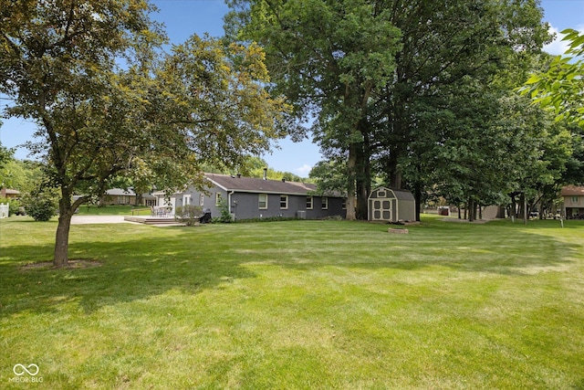 540 Lazy Ln, Greenwood, IN 46142 - view of green lawn featuring a shed