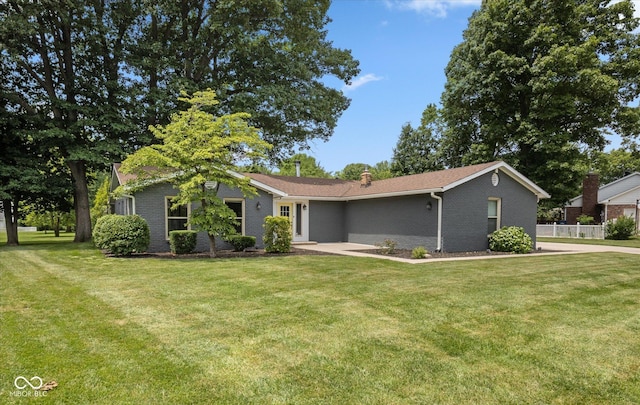 540 Lazy Ln, Greenwood, IN 46142 - view of front of property featuring brick siding, a front yard, and a chimney