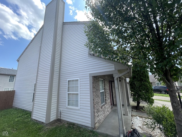 1503 Quinlan Ct, Indianapolis, IN 46217 - view of home's exterior with a chimney and brick siding