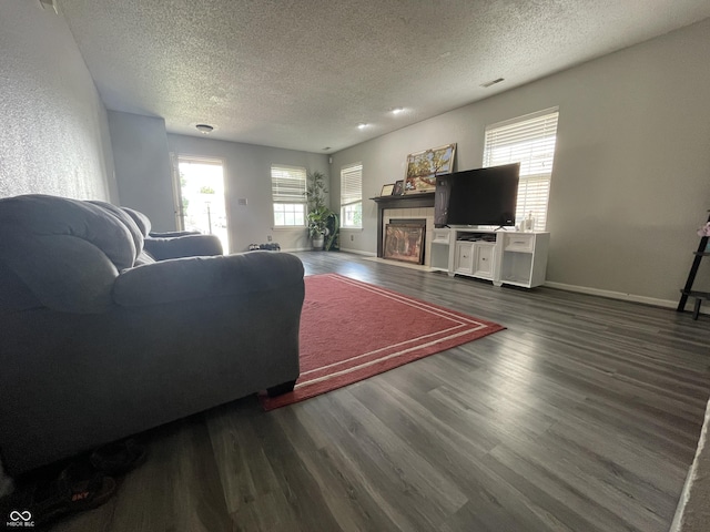 1503 Quinlan Ct, Indianapolis, IN 46217 - living area with a textured ceiling, wood finished floors, and a tile fireplace