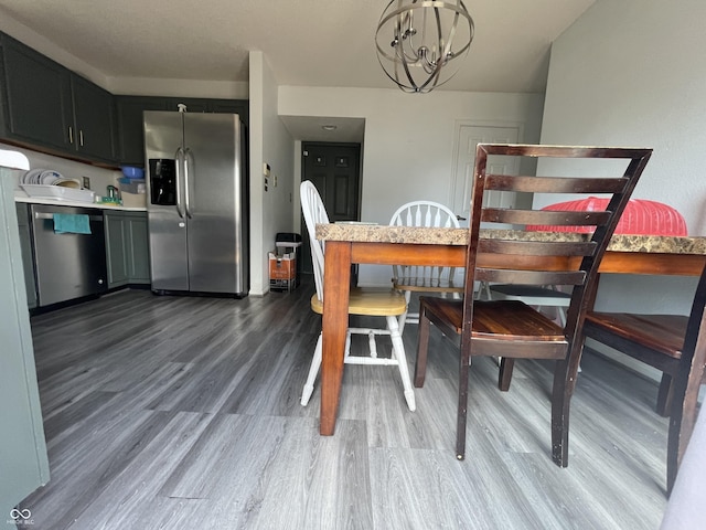 1503 Quinlan Ct, Indianapolis, IN 46217 - dining space featuring a chandelier and wood finished floors