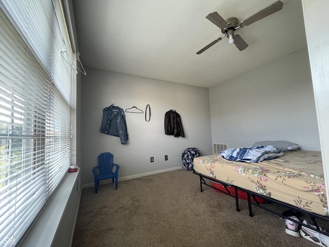 1503 Quinlan Ct, Indianapolis, IN 46217 - carpeted bedroom with a textured ceiling and a ceiling fan