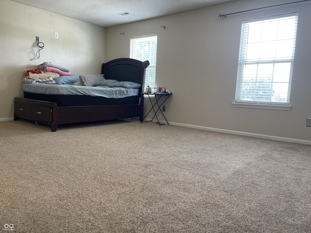 1503 Quinlan Ct, Indianapolis, IN 46217 - carpeted bedroom with baseboards and a textured ceiling